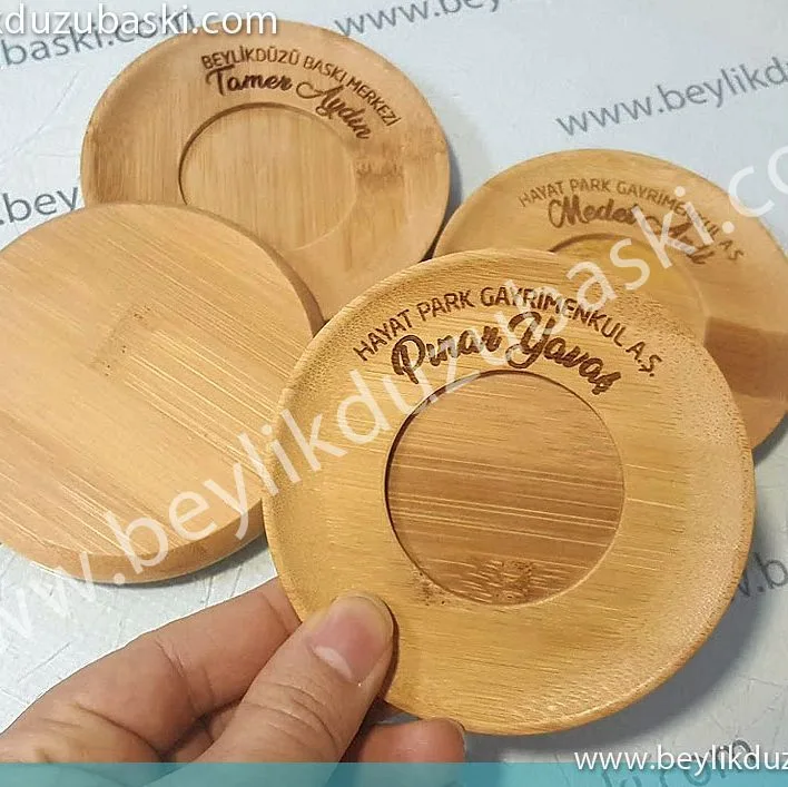 ahşap lazer kazıma, bambu lazer kazıma, bambu bardak altına kazıma ile yazı ve logo baskısı yapılmaktadır, lazer kazıma merkezi